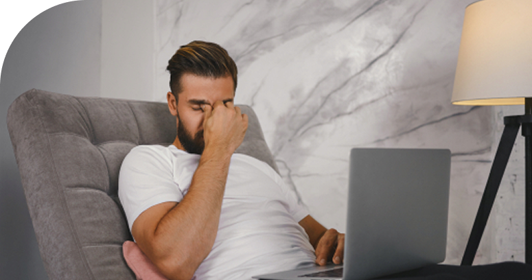 Coronary Artery Disease (Cad) 2 A Man Sitting In A Chair With His Hand On His Face Possible Symptom Of Can And Looking For Coronary Artery Disease Treatment In Dubai